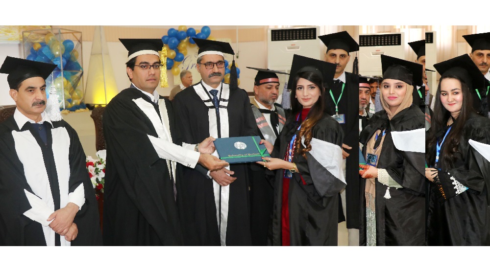 Pro Chancellor Kamran Khan Bangash distributes degrees among students of College of Home Economics, while accompanied by Vice Chancellor and Registrar, University of Peshawar.