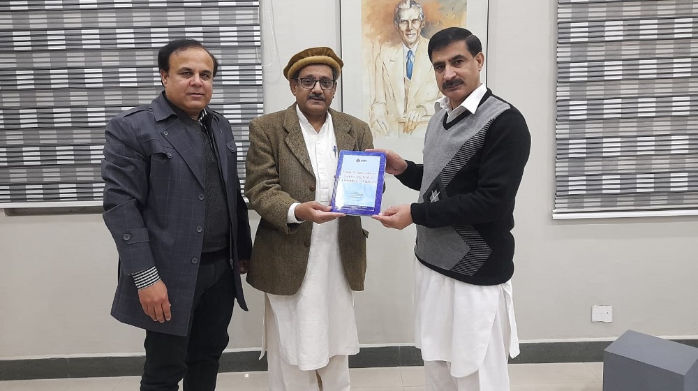 Dr. Shafqat Munir Ahmed, Director, Resilient Development Program at SDPI presenting edited book to Prof. Dr. Muhammad Idrees, Vice Chancellor, University of Peshawar which is recently published (October, 2021) by the SDPI in collaboration with Public Sector Universities of Pakistan.