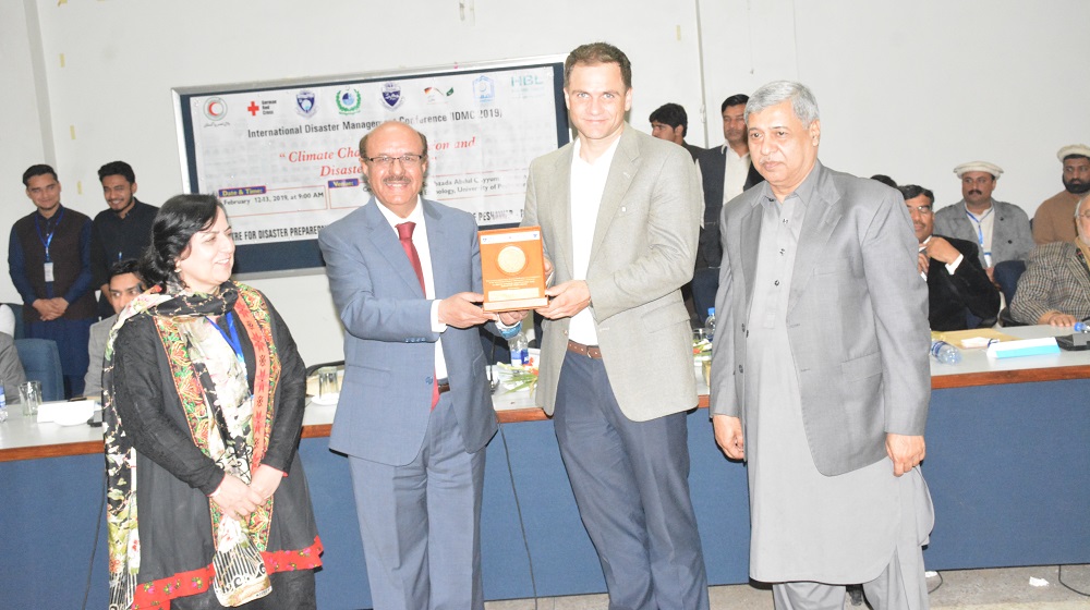 Vice Chancellor UoP Prof. Dr. Muhammad Asif Khan is handing over the memento of participation to the International Red Cross sub-delegation head at Peshawar Giovanni Trambaiolo at ICDM-2019 entitled as  Climate Change adaptation and resilience , conference organised under the auspices of CPDM, UoP.