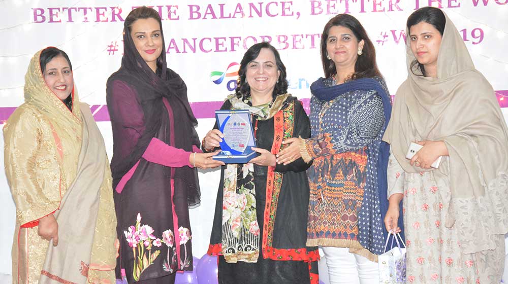 Prof.Noor Jahan chief guest on International Women's day event at TCC hall is handing over shield to guest of honor Ms.Ayesha Bano, MPA, before her departure from the function on 08th March,2019.