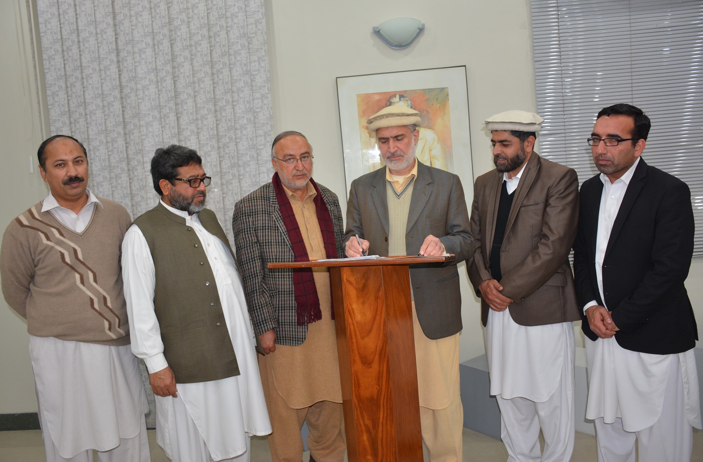 Prof. Dr. Muhammad Abid Signing Assumption of Charge report as PRO-VICE CHANCELLOR of the University of Peshawar