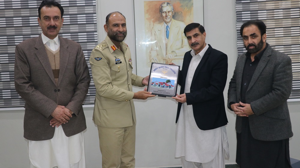 Principal Army Burn Hall College for Girls, Abbotabad, Brig Naveed presents college's souvenir to Vice Chancellor Prof. Dr. Muhammad Idrees upon his visit to the University of Peshawar.