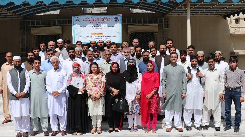 The pro-vice chancellor, University of Peshawar Prof. Dr. Muhammad Abid posing with a group of 40 participants at the inaugural session of two-day workshop entitled as 