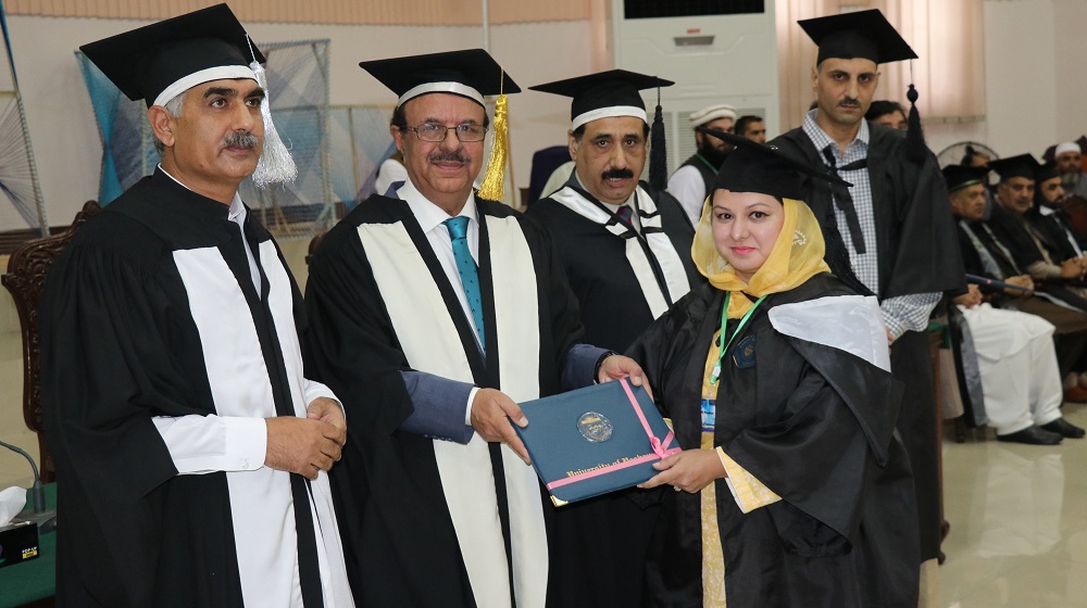 Vice Chancellor, University of Peshawar Prof.Dr. Muhammad Asif Khan along with pro-vice chancellor, registrar and dean  is handing  over degree to PhD degree holder  at the convocation 2019 for the session 2016-17 on November, the 7th, 2019.