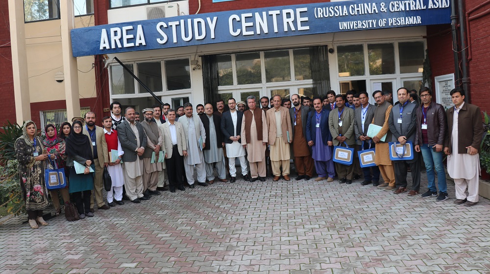 A group photo of participants, faculty  and organizers of the fifth international conference organised by the department of History is standing at the facade of Conference Hall, on 9th December, 2019.