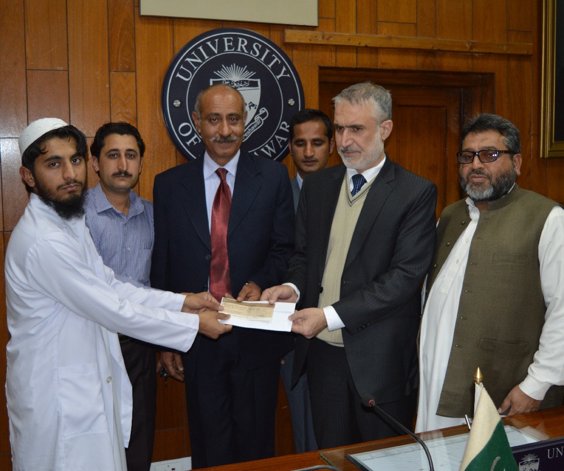 Pro Vice Chancellor UoP Prof. Dr. Muhammad Abid giving away Cash Prize of Rs. 50,000/- to Mr. Haseeb Ahmad (Student of F.Sc Pre Medical) at University College for Boys (UCB), for securing 11th Position in BISE Examinations