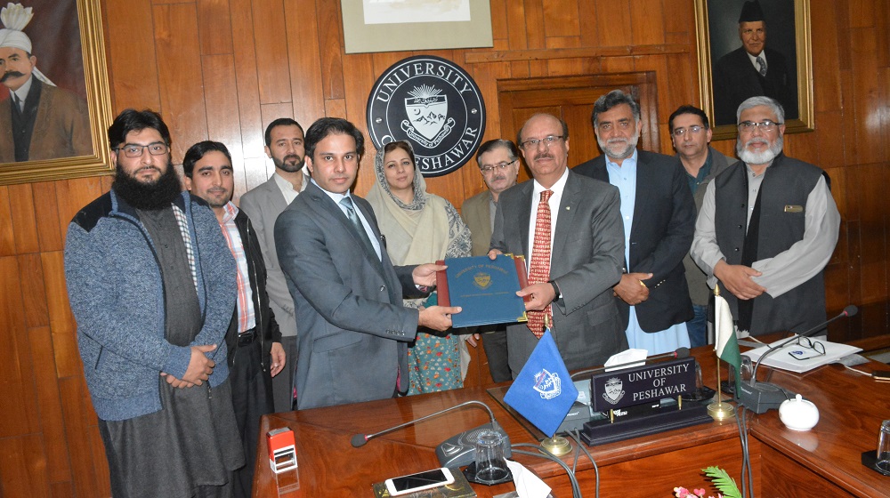 UoP officials along with Worthy Vice Chancellor is posing for a group photo after  signing a memorandum of understanding with State Banks' subsidiary National  Institute of Banking & Finance to promote national financial literacy program among youth of University of Peshawar on 19th February, 2019.